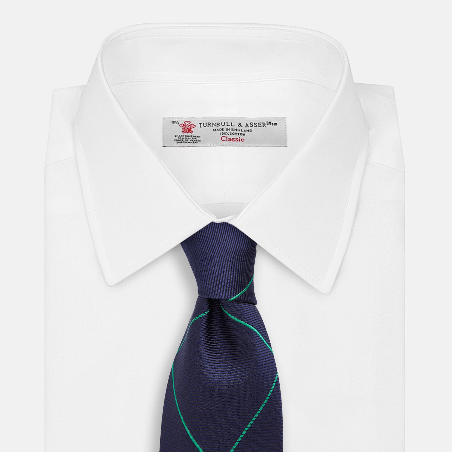 View 2 of product The Turnbull & Asser Green and Navy Window Pane Silk Tie features a subtle ribbed texture with a diagonal green grid pattern, inspired by archival designs—a stylish choice for modern office attire.