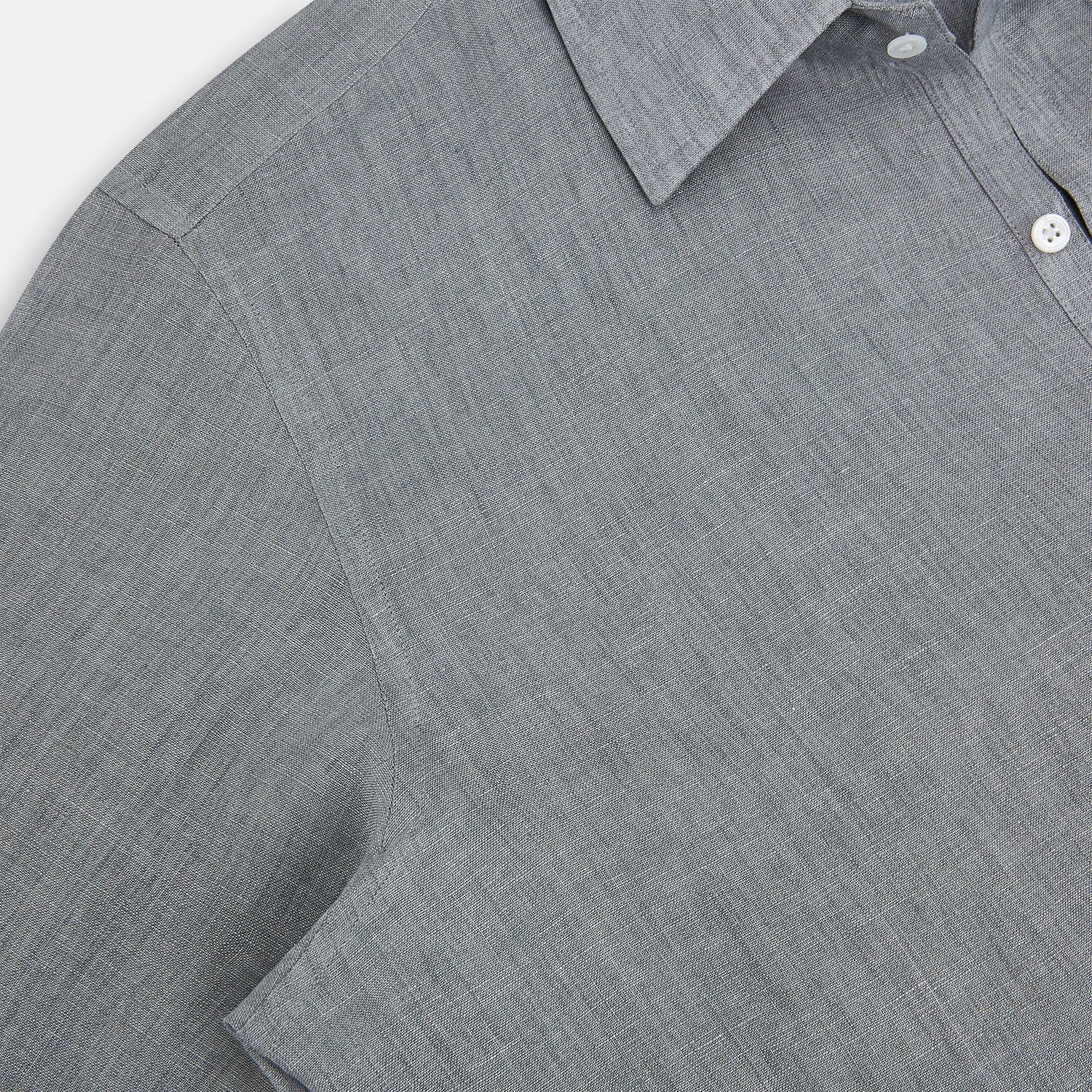 View 6 of product The Grey Linen Westminster Shirt by Turnbull & Asser is a long-sleeve, light gray button-up with a formal collar and white buttons, highlighting British craftsmanship and laid flat on a white background.