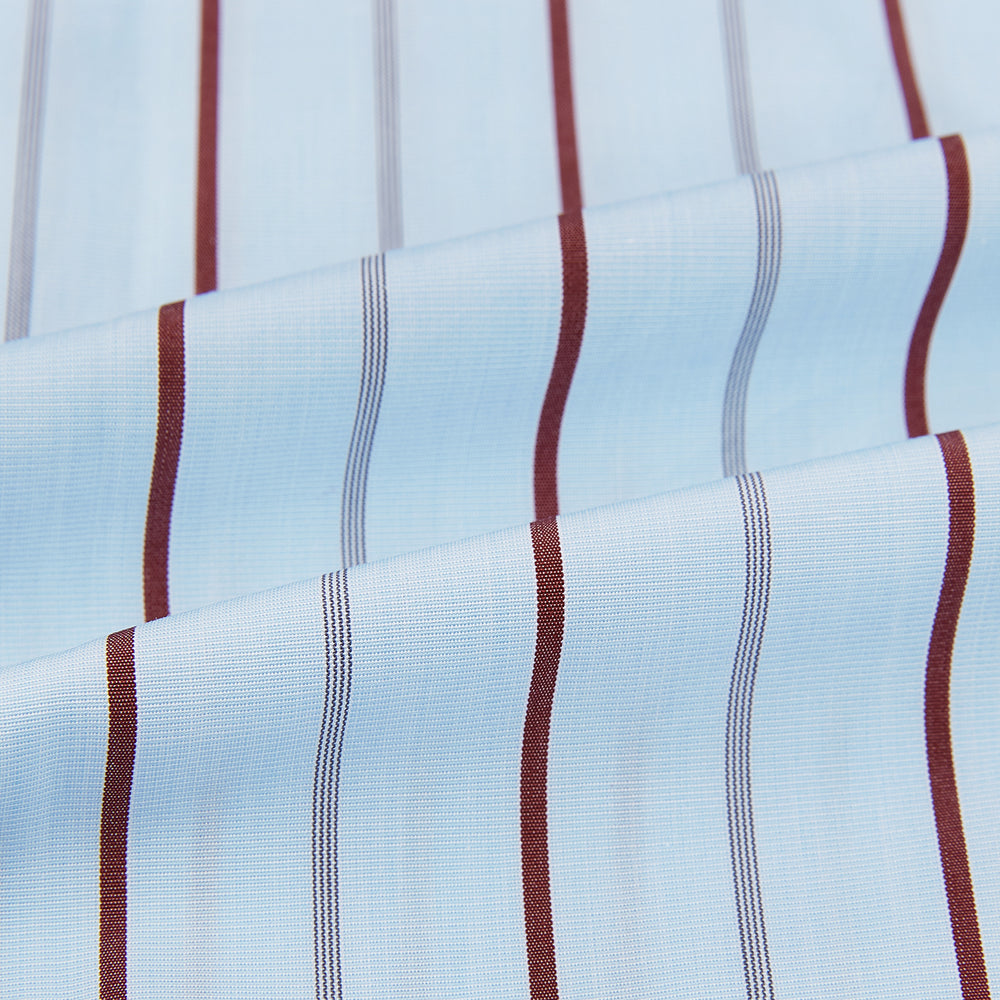 The Turnbull & Asser Burgundy Wide Pinstripe Mayfair Shirt features a collared, long-sleeve design with bold vertical stripes, crafted in the refined Mayfair fit and displayed on a plain white background.