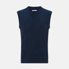 View 1 of product The Turnbull & Asser Navy Melange V-neck Cashmere Vest is a sleeveless jumper with a classic, pattern-free design, showcased against a plain white background for an elegant and timeless look.