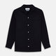 A Navy Cotton Holiday Fit Winnington Shirt by Turnbull & Asser, featuring long sleeves, a chest pocket, white buttons, and a revere collar, is laid flat on a white background.
