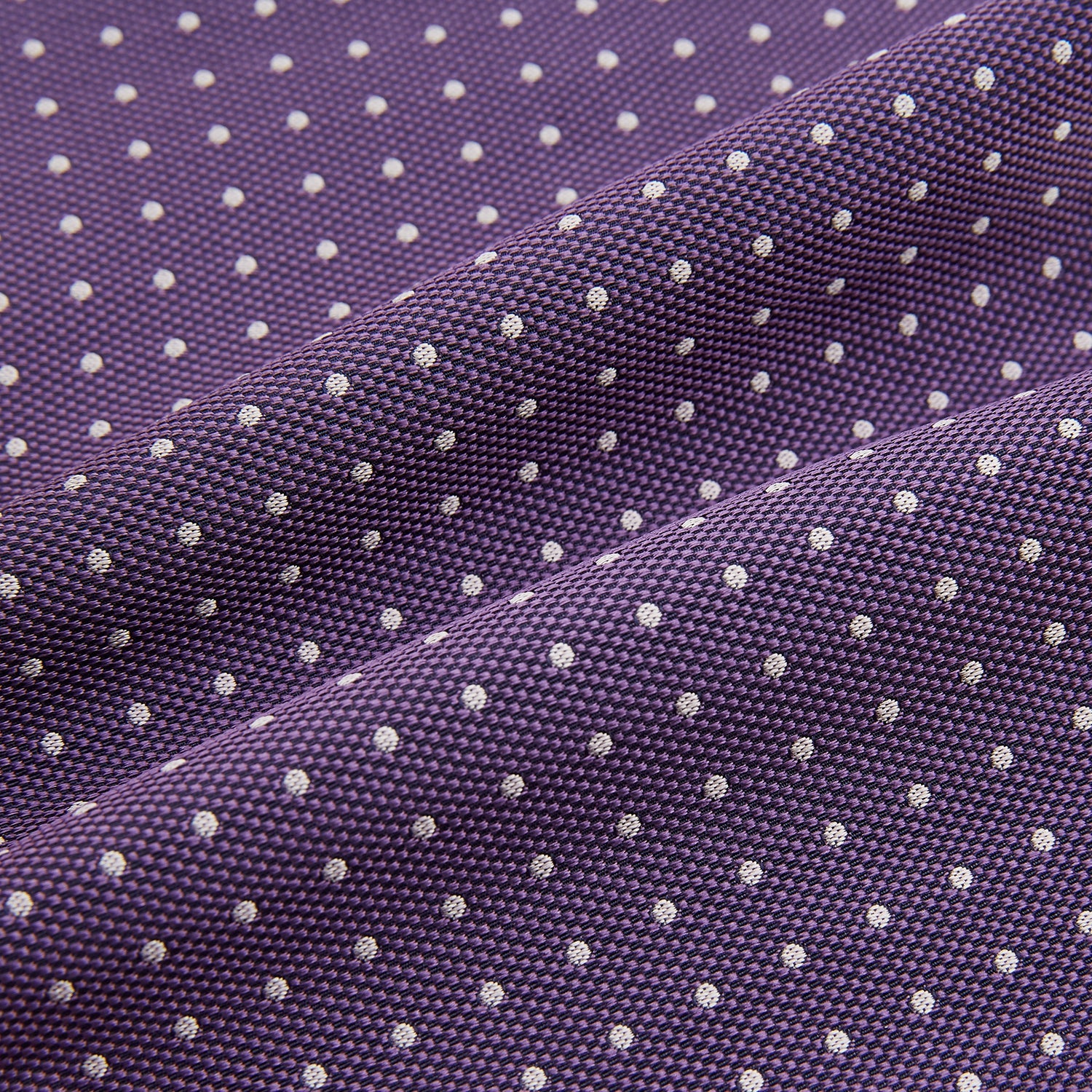 View 4 of product The Lilac and Purple Micro Dot Silk Cravat by Turnbull & Asser features evenly spaced white dots—offering an elegant, handmade accent to your formal ensemble or pocket square collection.