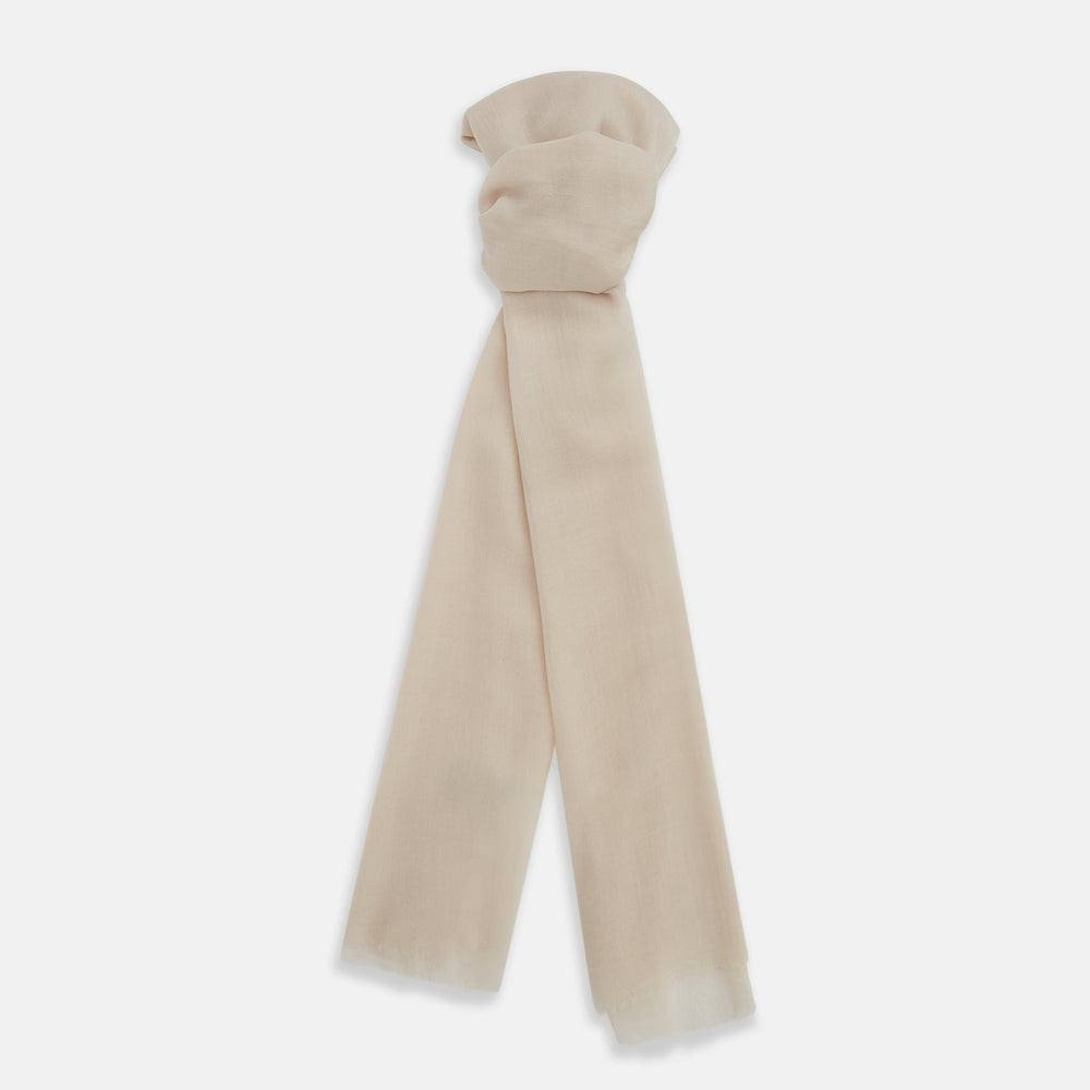 The Turnbull & Asser Rose Cashmere Scarf, in light beige and semi-sheer, is elegantly folded on a white background—an exquisite luxury accessory.