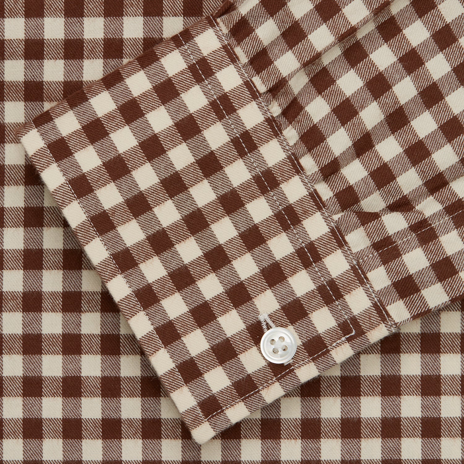 View 5 of product The Turnbull & Asser Brown Check Weekend Fit Shirt features a Derby collar, 1-button cuffs, and a brown check pattern—ideal for winter layering. Shown against a plain white background.