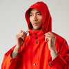 View 5 of product Wearing the Turnbull & Asser Red Walter Sealup Parka with Detachable Liner, black pants, and white sneakers, a person stands in profile against a plain light background—perfect for travel.