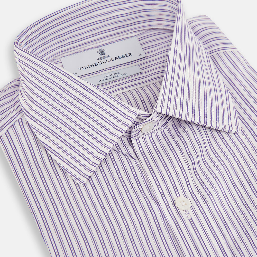 The Turnbull & Asser Purple Ticking Stripe Mayfair Shirt is a long-sleeve button-up with a T&A collar and slim blue-and-white vertical stripes, shown on a white background.