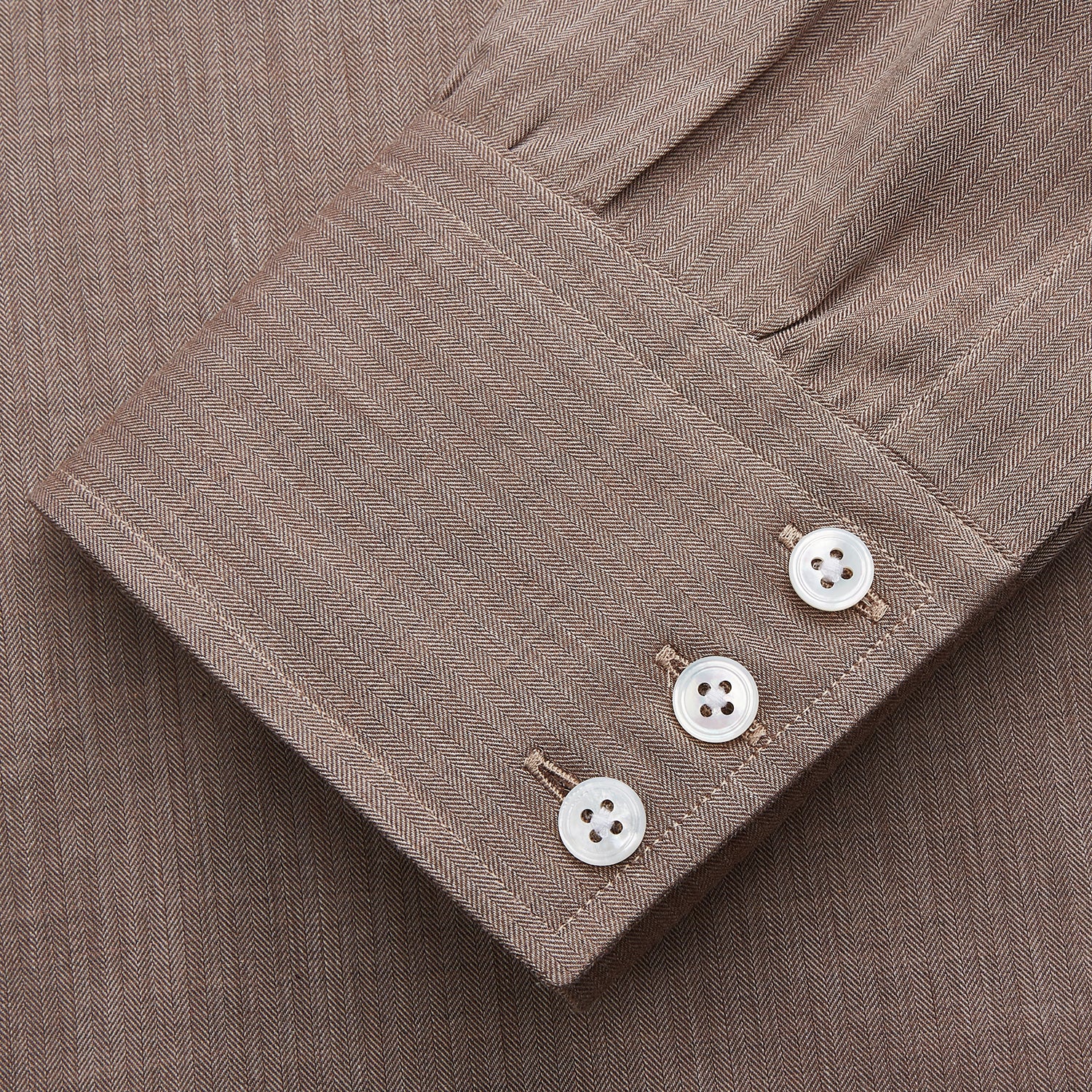 View 2 of product The Turnbull & Asser Camel Cotton Melange Regular Fit Mayfair Shirt features long sleeves, a classic T&A collar, white buttons, and buttoned cuffs in light brown cotton melange, displayed flat on a white background.