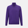 View 1 of product The Turnbull & Asser Purple Fine Merino High Neck Jumper is shown on a white background, featuring a plain, long-sleeved design that highlights the classic elegance of Italian knitwear.