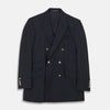 View 1 of product The Classic Navy Wool Blazer by Turnbull & Asser features a double-breasted design, gold buttons, notched lapels, and multiple front pockets, shown on a white background. This piece offers timeless, sophisticated nautical style.