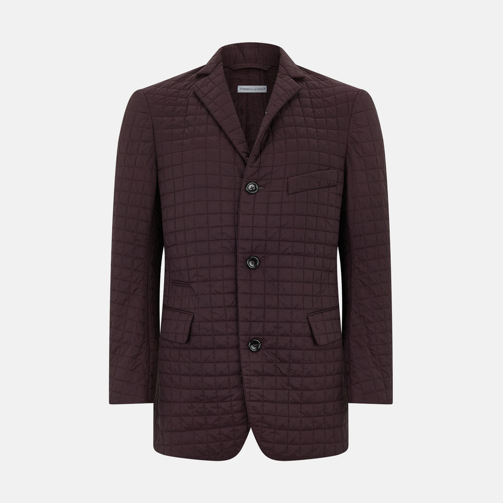 The Fulham Burgundy Single-Breasted Quilted Blazer by Turnbull & Asser features a grid pattern, notch lapel, three buttons, and three front pockets. Shown on a plain white background—ideal for the modern gentleman.