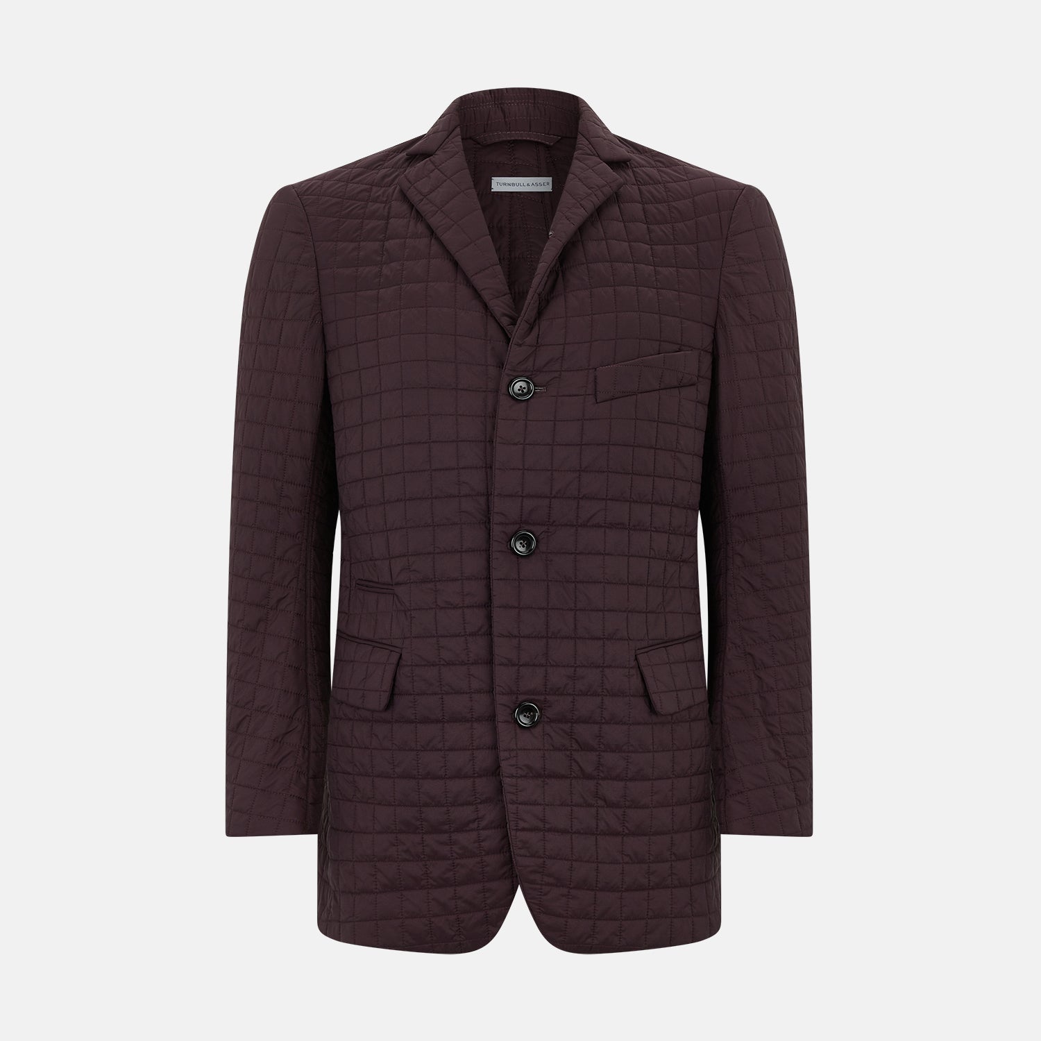 View 1 of product The Fulham Burgundy Single-Breasted Quilted Blazer by Turnbull & Asser features a grid pattern, notch lapel, three buttons, and three front pockets. Shown on a plain white background—ideal for the modern gentleman.