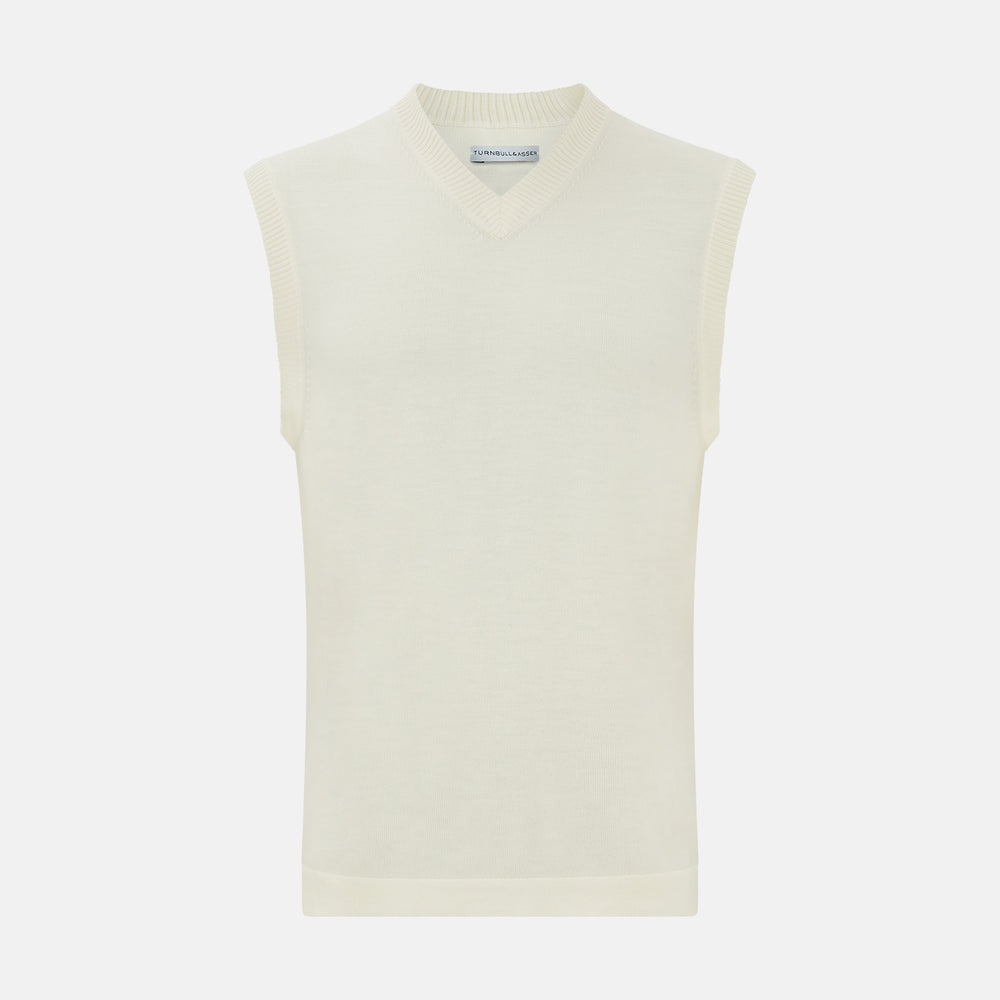 The Turnbull & Asser Cream Fine Merino V-Neck Vest is a sleeveless knit with ribbed edges, ideal for a refined modern look. Shown on a plain white background.