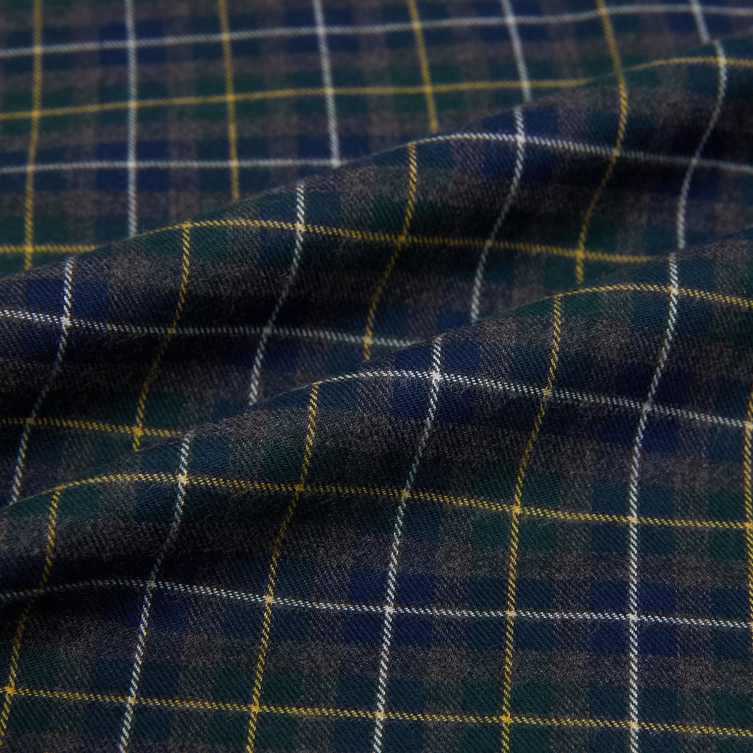 View 8 of product The Turnbull & Asser Navy and Khaki Tartan Windsor Shirt features a long-sleeve button-up design with a Windsor collar and buttoned cuffs, showcasing British craftsmanship in a classic tartan pattern.