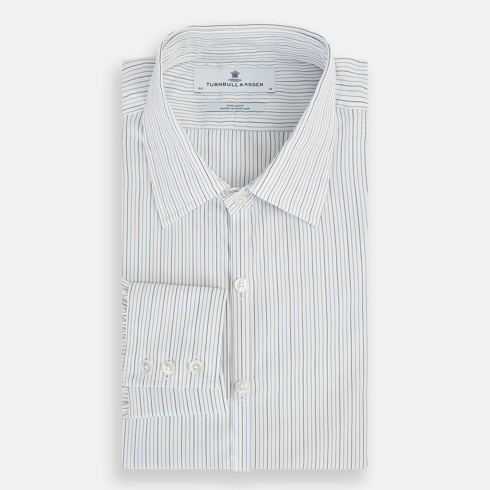 The Turnbull & Asser Grey and Blue Pinstripe Westminster Shirt features fine stripes, a classic collar, and buttoned cuffs—showcasing signature British craftsmanship against a plain white backdrop.