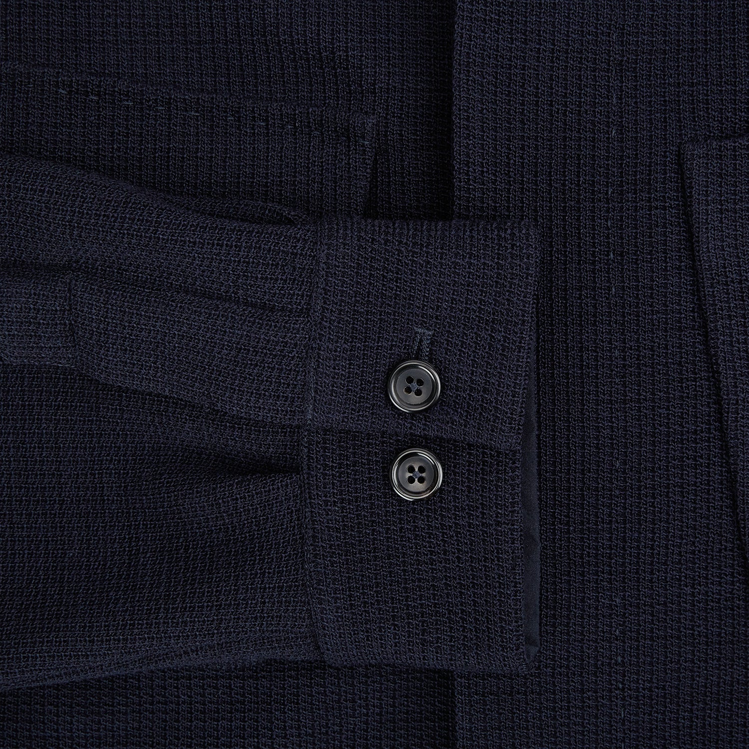 View 4 of product The Turnbull & Asser Navy Greenwich Knitted Overshirt, made from Italian wool with a collar, two front flap pockets, and a hidden button placket, is shown laid flat on a white background.