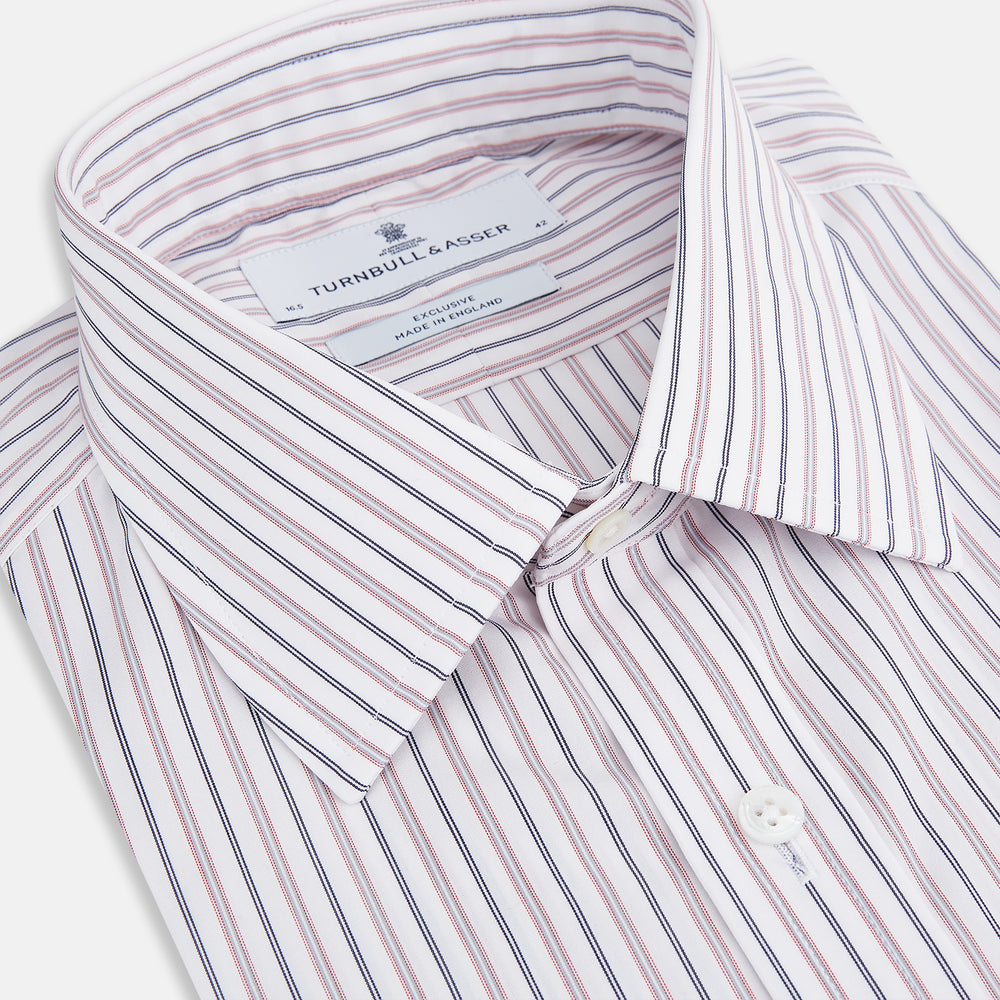 The Turnbull & Asser Red Multi Stripe Mayfair Shirt is a long-sleeve, button-up classic with a sharp collar and vibrant red multi stripes—an essential men's piece shown against a white background.