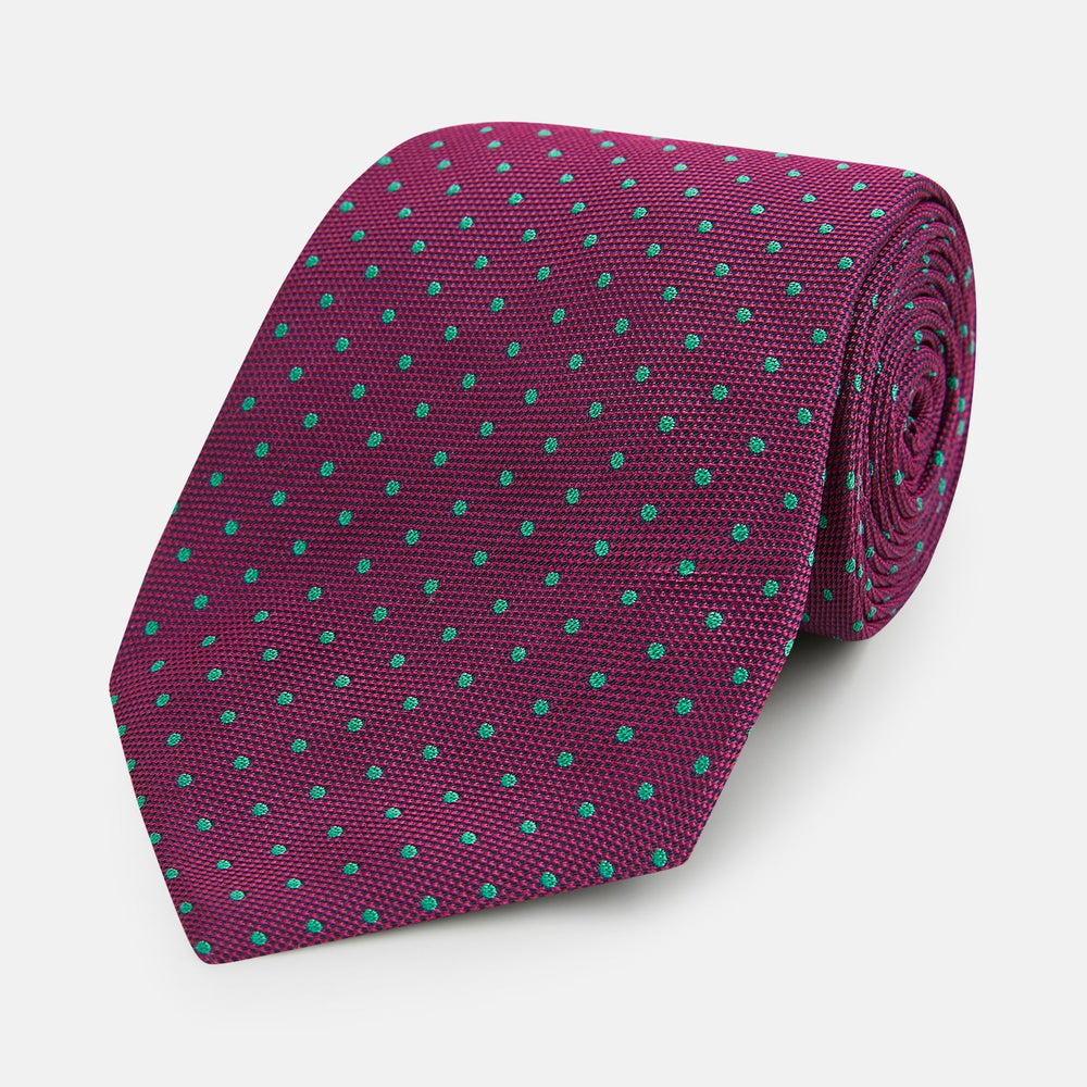 A smart accessory, the Antique Pink and Green Micro Dot Silk Tie by Turnbull & Asser is a striking spotted silk tie displayed on a white background.