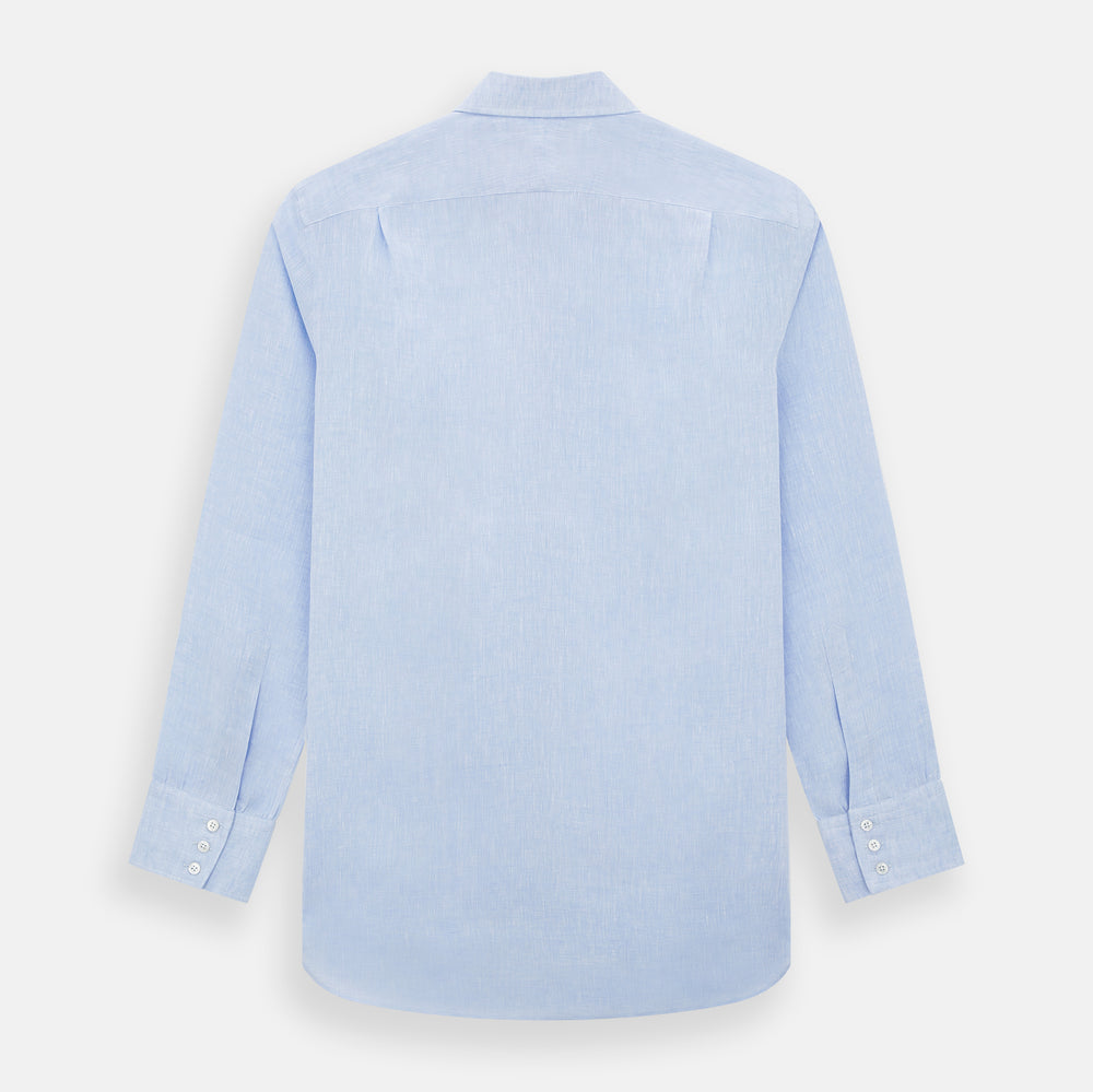 The Turnbull & Asser Pale Blue Linen Mayfair Shirt features a collar, front pocket, and white buttons. This long-sleeve shirt is displayed on a white background.