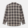 View 5 of product The Brown Multi Check Linen Weekend Fit Unwin Shirt by Turnbull & Asser features a beige, brown, and black plaid pattern, stand collar, button-up front, long sleeves, and two buttoned chest pockets.