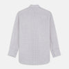 View 7 of product A man stands against a beige background, facing forward with a neutral expression and arms relaxed, wearing the Turnbull & Asser Red Multi Check Regular Fit Mayfair Shirt.