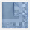 View 1 of product The Turnbull & Asser Pale Blue Dot Silk Pocket Square features pure silk in pale blue with a border and scattered small navy polka dots, neatly folded with one corner turned down.