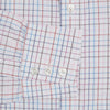 View 3 of product The Turnbull & Asser Pink Multi Double Grid Check Mayfair Shirt, made from organic cotton with a pointed collar and buttoned cuffs, features a light pink base with blue and red grid checks and is shown flat on a white background.