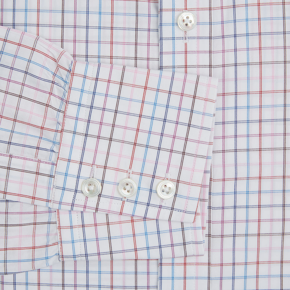 The Turnbull & Asser Pink Multi Double Grid Check Mayfair Shirt, made from organic cotton with a pointed collar and buttoned cuffs, features a light pink base with blue and red grid checks and is shown flat on a white background.