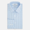 View 5 of product The Navy and Blue Combination Check Mayfair Shirt by Turnbull & Asser features a light blue base with a grid of thin dark blue lines, long sleeves, a pointed collar, and is neatly displayed on a plain white background.