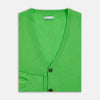 View 4 of product The Turnbull & Asser Lime Green Fine Merino V-Neck Cardigan features long sleeves and dark brown front buttons, shown against a plain white background.
