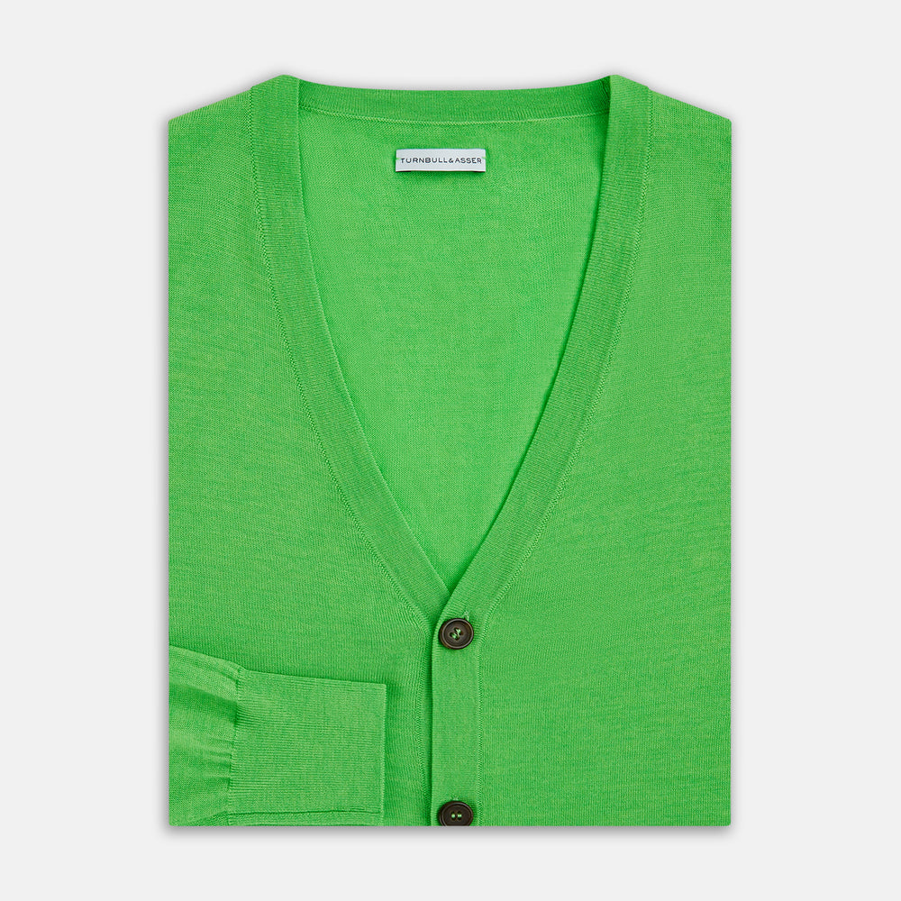 The Turnbull & Asser Lime Green Fine Merino V-Neck Cardigan features long sleeves and dark brown front buttons, shown against a plain white background.