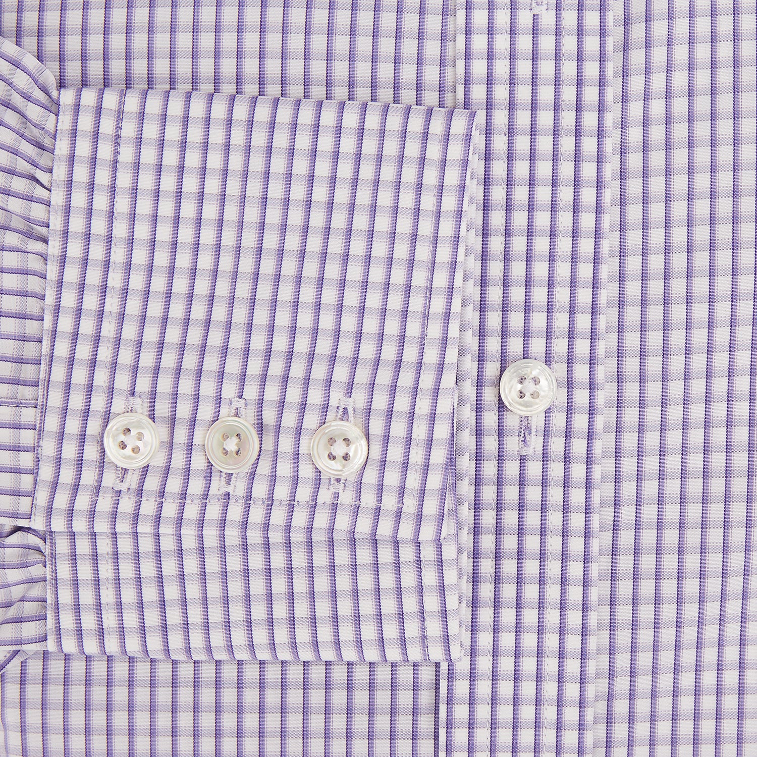 View 4 of product The Turnbull & Asser Purple Micro Shadow Check Mayfair Shirt features long sleeves, a classic collar, white buttons, and a subtle blue and white check pattern—perfect for formal wear and shown on a plain white background.