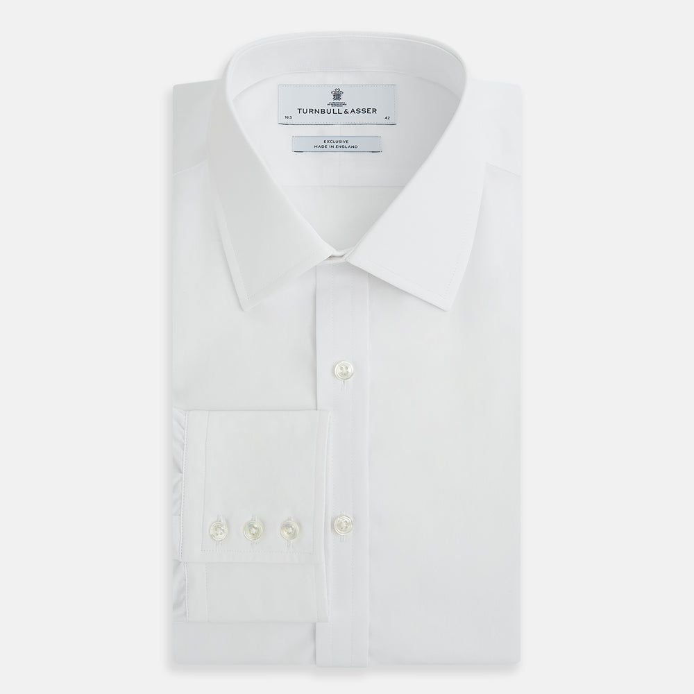 The White Mayfair Shirt by Turnbull & Asser features a classic collar, white buttons, and an inner branded label, all neatly crafted from premium sanforised cotton for lasting quality.