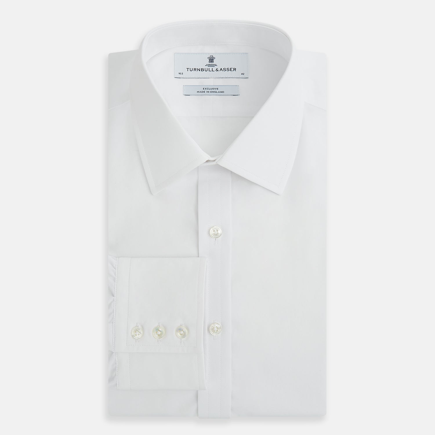 View 5 of product The White Mayfair Shirt by Turnbull & Asser features a classic collar, white buttons, and an inner branded label, all neatly crafted from premium sanforised cotton for lasting quality.