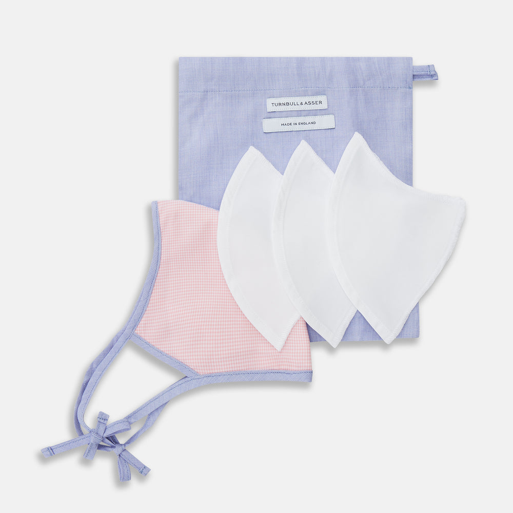 The Turnbull & Asser Pink & Blue Check Commuter Mask features lavender adjustable ear loops tied in bows and comes with 3 Viroformula™ filters. Shown on a plain white background.