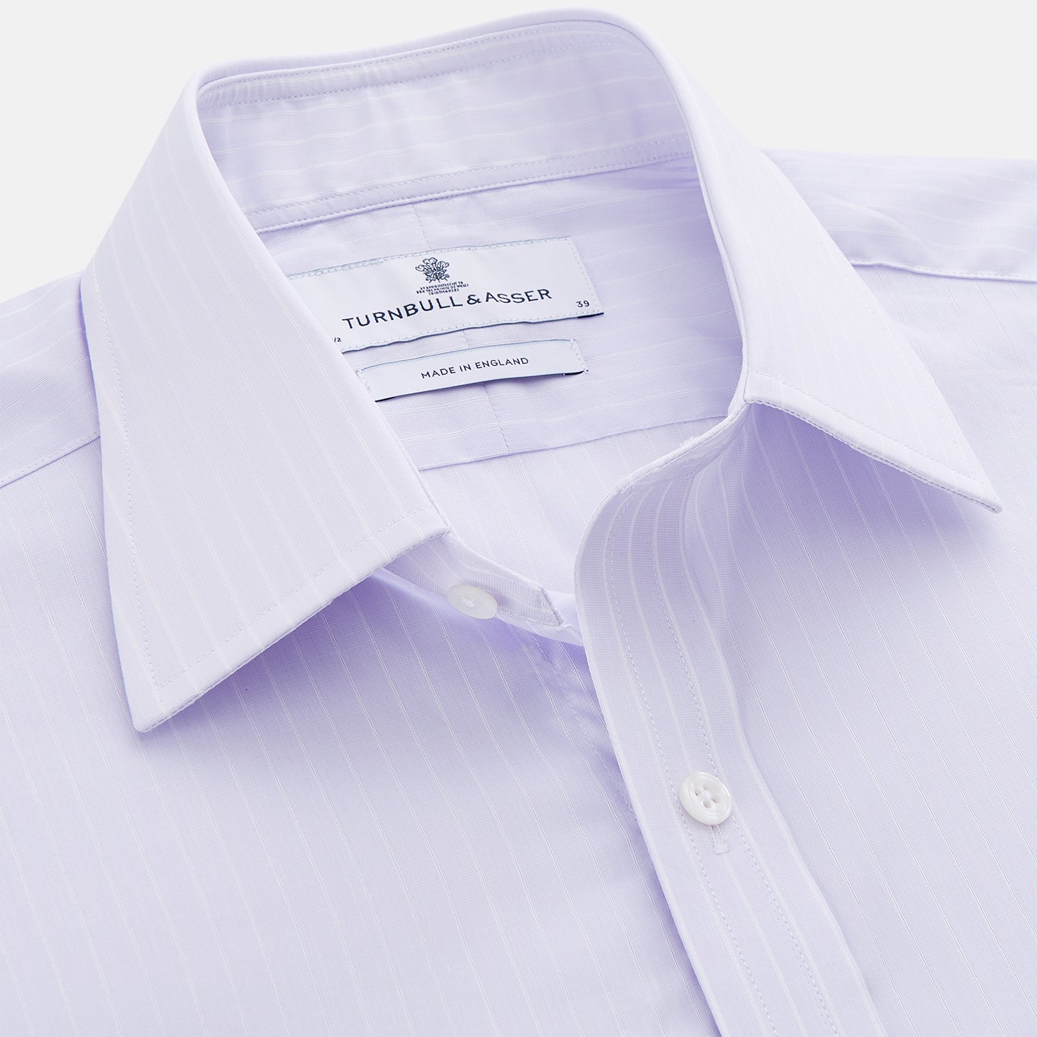 View 2 of product The Turnbull & Asser Soft Lilac Stripe Cotton Regular Fit Mayfair Shirt features a classic collar, cuffed long sleeves, and subtle vertical stripes, shown on a plain white background.