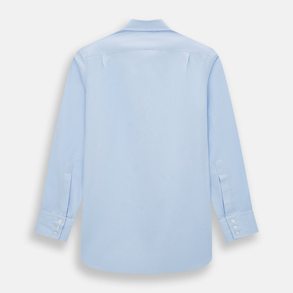 The Pale Blue Rhombus Mayfair Shirt by Turnbull & Asser features long sleeves, a classic collar, white buttons, and buttoned cuffs, shown laid flat on a white background.