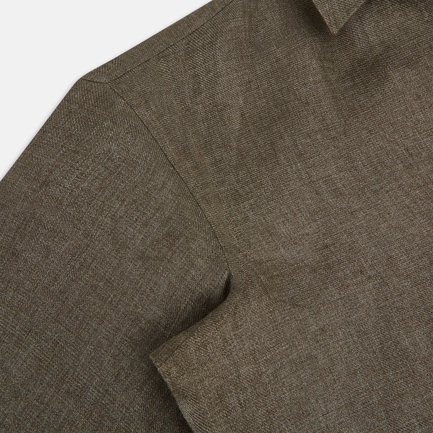 View 6 of product The Olive Linen Windsor Shirt by Turnbull & Asser features long sleeves, a classic Windsor collar, buttoned cuffs, and a straight hem—expertly crafted in Britain and shown against a white background.