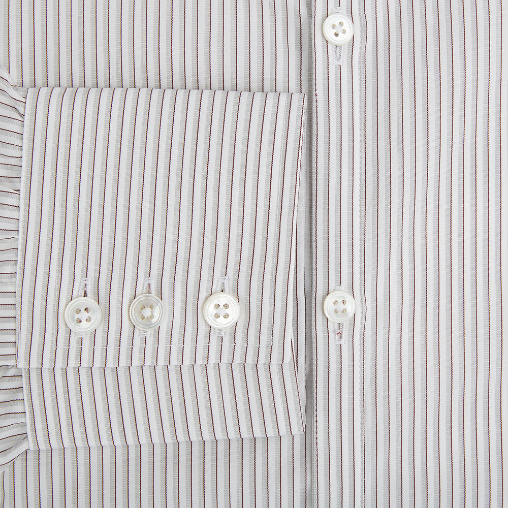 The Coffee and Grey Shadow Pinstripe Westminster Shirt by Turnbull & Asser features thin white and gray stripes, a long sleeve, button-down style, and signature collar, all reflecting classic British craftsmanship.