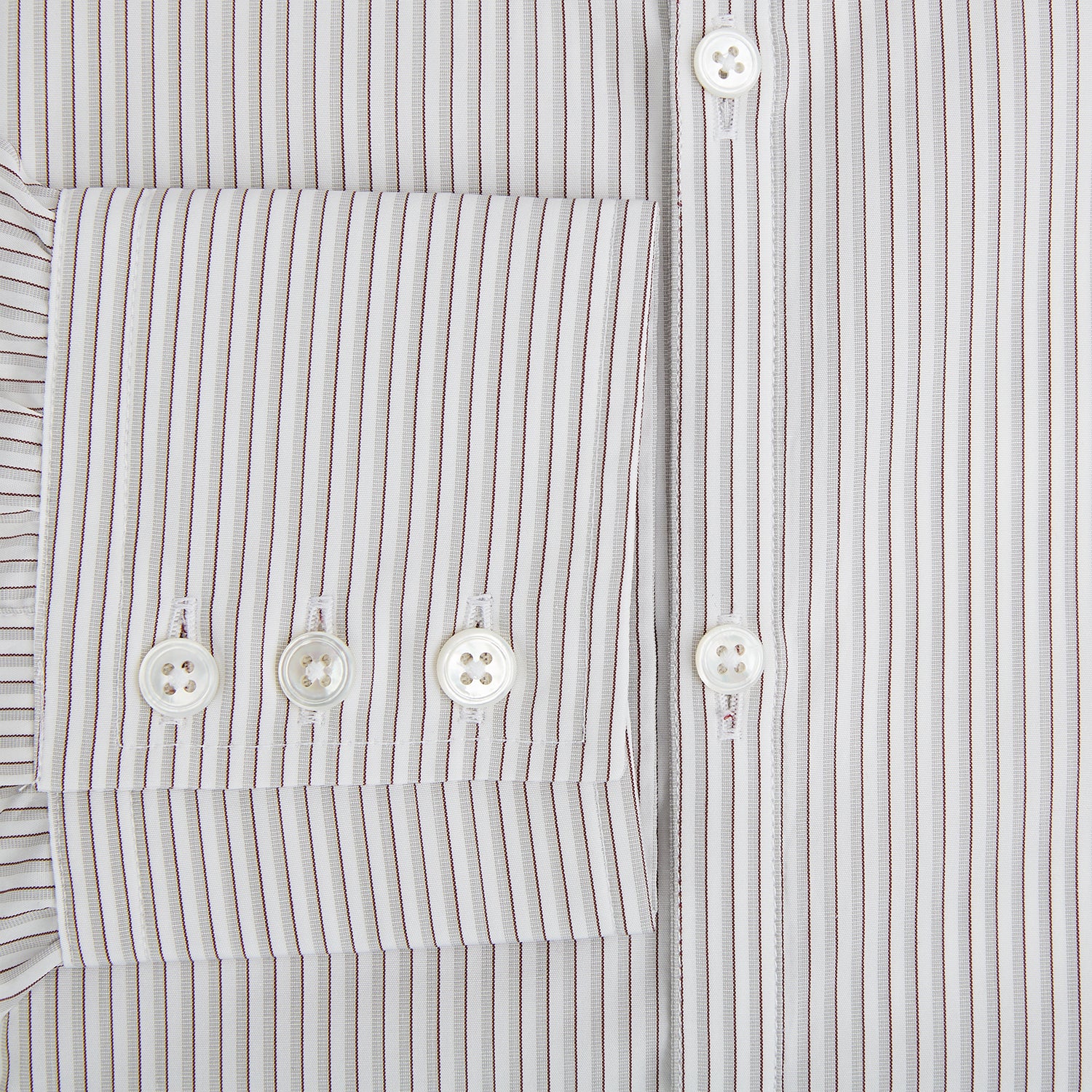 View 4 of product The Coffee and Grey Shadow Pinstripe Westminster Shirt by Turnbull & Asser features thin white and gray stripes, a long sleeve, button-down style, and signature collar, all reflecting classic British craftsmanship.