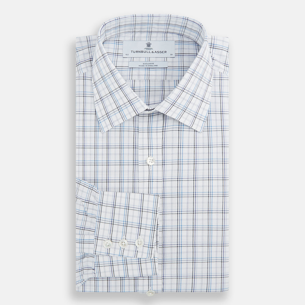 The Turnbull & Asser Purple and Blue Multi Check Mayfair Shirt features long sleeves, a button-up front, and a classic T&A collar, with blue and light gray checks on white, displayed flat against a plain white background.