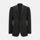The Turnbull & Asser Charcoal Glen Check Sports Jacket features a dark plaid pattern, single-button closure, notched lapels, and two front flap pockets, shown against a plain white background—an essential for any men's wardrobe.