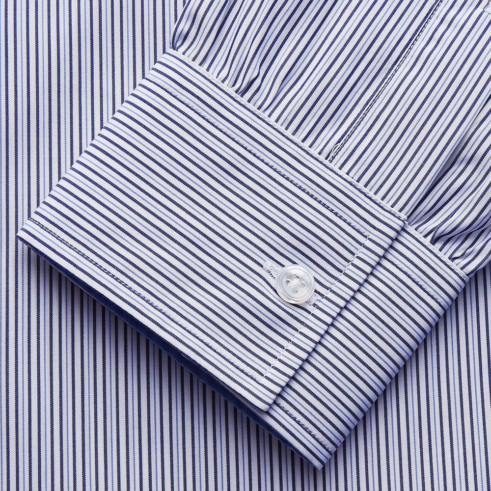 The Turnbull & Asser Blue Multi Stripe Cotton RE-PURPOSE Weekend Fit Finch Shirt features thin blue and white stripes, a contrasting light blue checkered chest pocket, and is crafted sustainably using recycled fabrics.