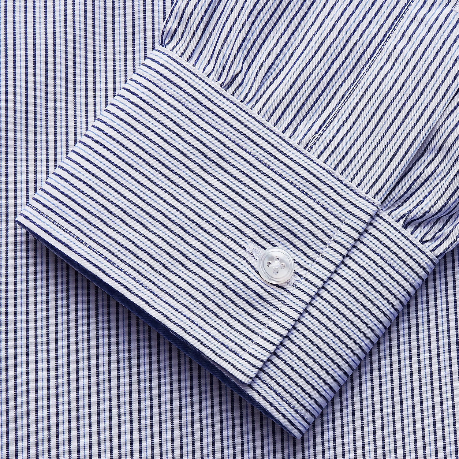 View 4 of product The Turnbull & Asser Blue Multi Stripe Cotton RE-PURPOSE Weekend Fit Finch Shirt features thin blue and white stripes, a contrasting light blue checkered chest pocket, and is crafted sustainably using recycled fabrics.
