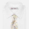 View 2 of product A rolled-up Cream Multi Bloomsbury-Inspired Pattern Silk Tie by Turnbull & Asser, featuring a pastel floral and paisley design in green, blue, pink, and orange tones, displayed on a white background.