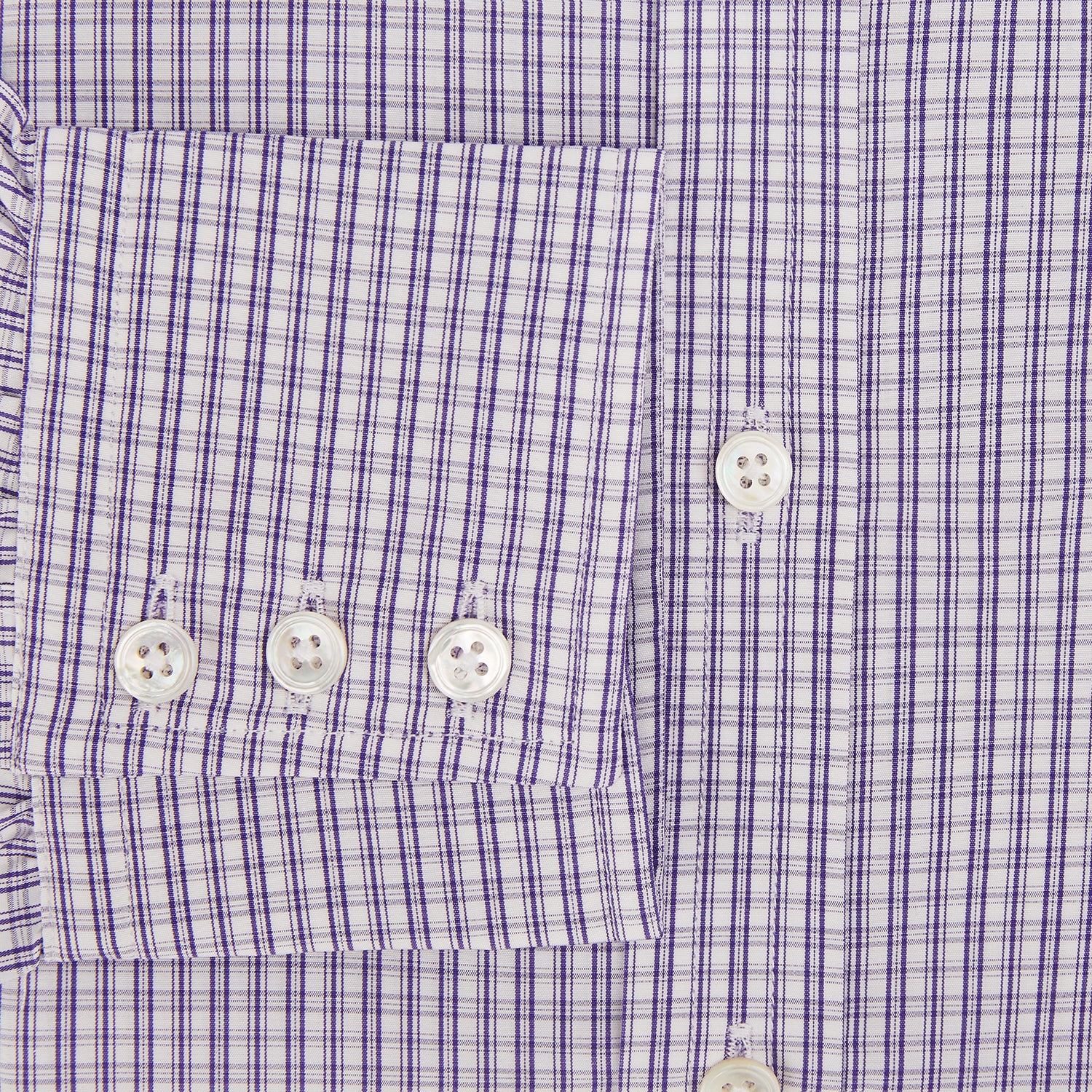 View 4 of product The Turnbull & Asser Purple Double Graph Check Mayfair Shirt is a long-sleeved, button-up dress shirt with a T&A collar and small blue and white check pattern, shown against a white background.
