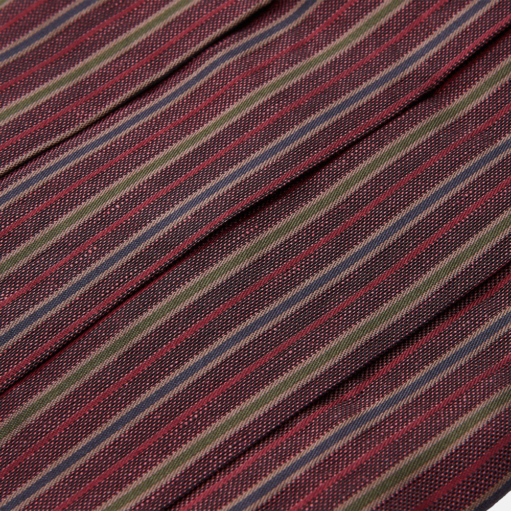 The Turnbull & Asser Claret and Green Multi Stripe Silk and Linen Cummerbund, featuring red, burgundy, green, and gold stripes reminiscent of sartorial elegance, is displayed on a plain white background.