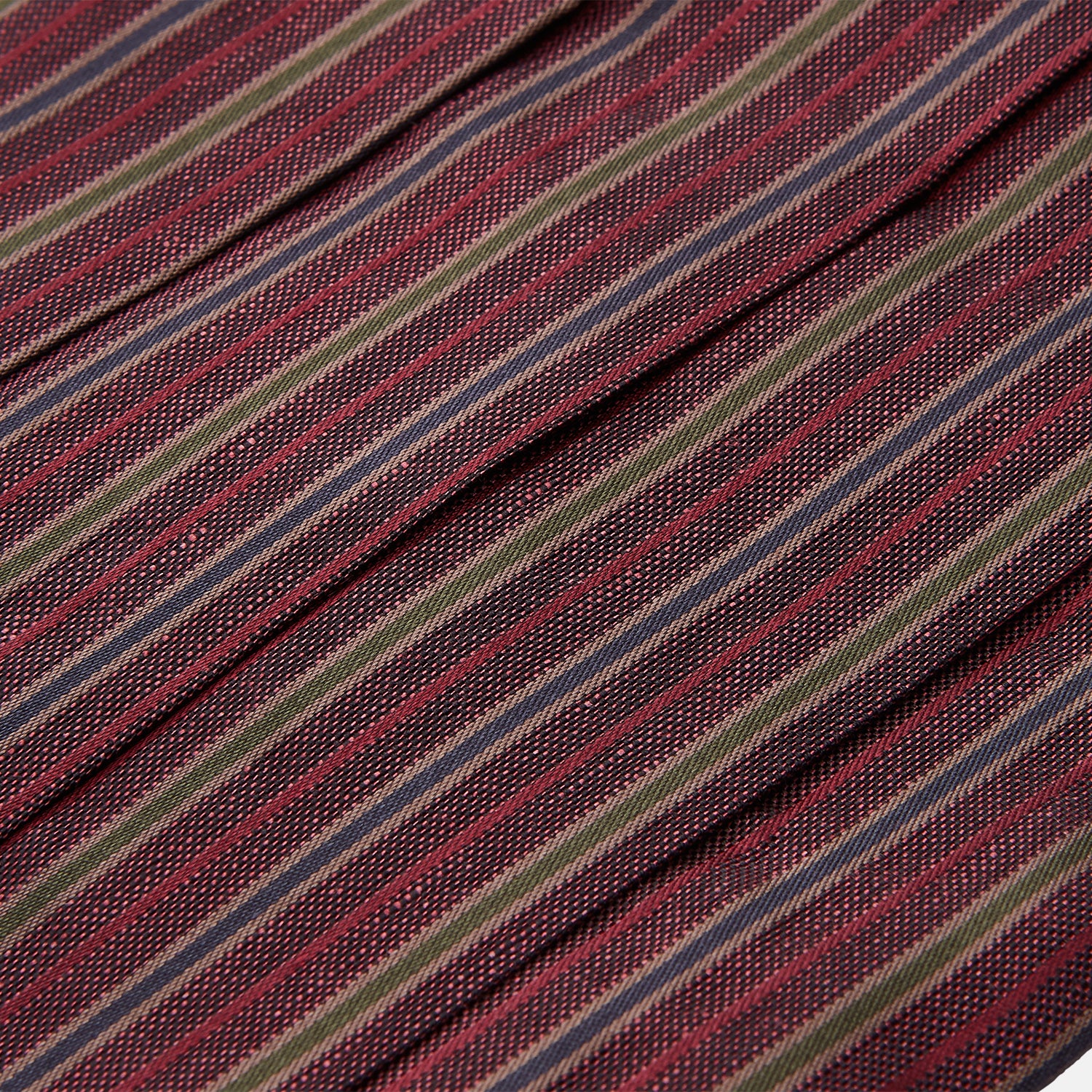 View 2 of product The Turnbull & Asser Claret and Green Multi Stripe Silk and Linen Cummerbund, featuring red, burgundy, green, and gold stripes reminiscent of sartorial elegance, is displayed on a plain white background.