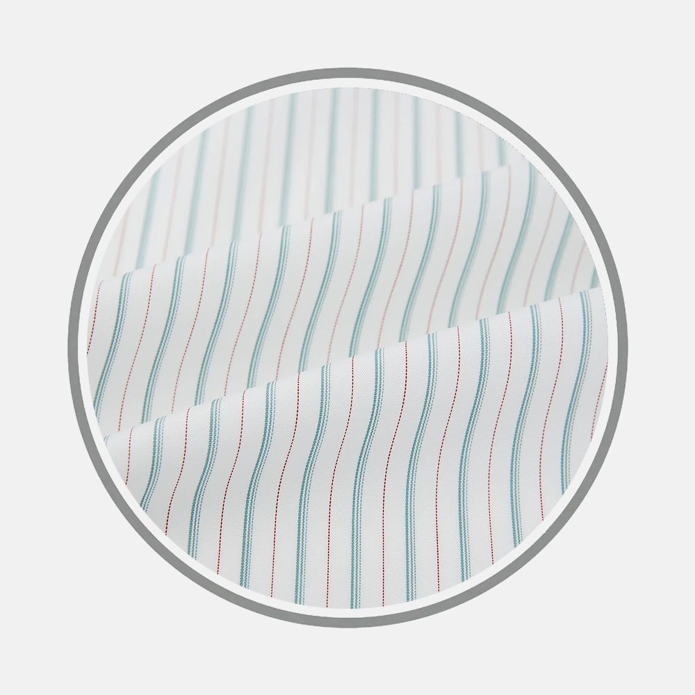 Close-up of Turnbull & Asser's Turquoise And Red Ticking Stripe Fabric, featuring evenly spaced vertical stripes in blue and red, displayed within a circular frame on a light gray background.