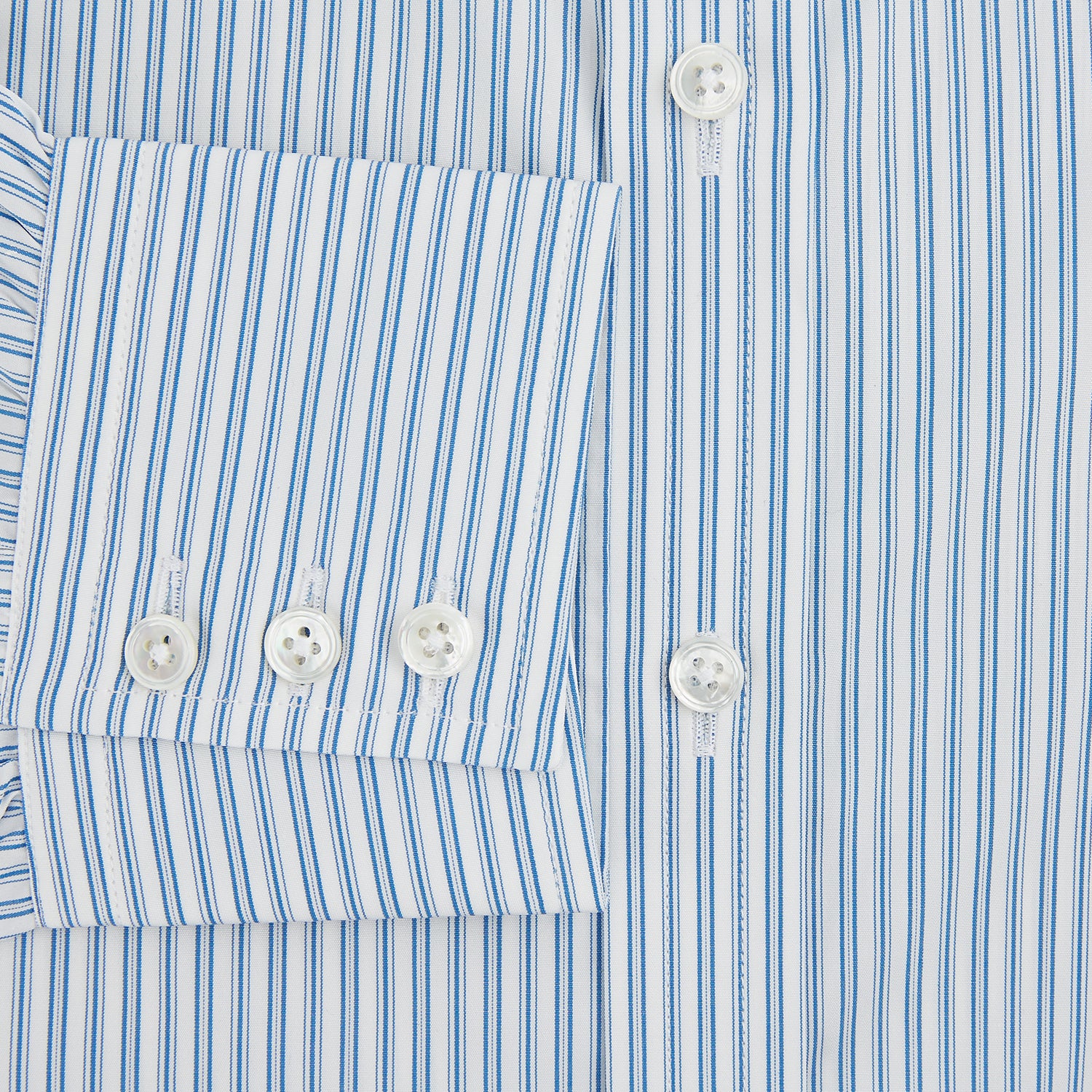 View 4 of product The Turnbull & Asser Sky Blue Double Stripe Mayfair Shirt features sky blue and white vertical stripes, a T&A collar, buttoned cuffs, and is displayed flat on a white background.