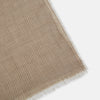 View 2 of product A Turnbull & Asser Beige and White Striped Cashmere Scarf, featuring a subtle pattern and fringed edge, is neatly folded and knotted against a plain white background.
